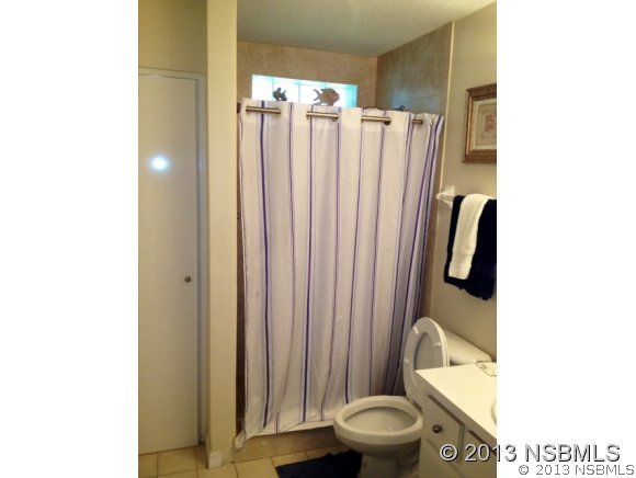 3224 Mango Tree Drive Edgewater, FL 32141 - Photo 17 of 17 a bathroom with a toilet and a shower