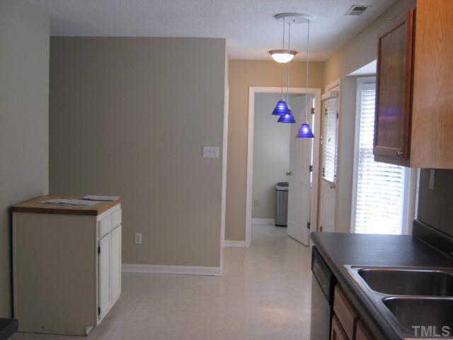 5816 Edgebury Road Raleigh, NC 27613 - Photo 8 of 12 Eat-in breakfast area in kitchen with bay window, door leads out on your back pard patio. Cooking out is a breeze with location of kitchen being so close to your back patio!