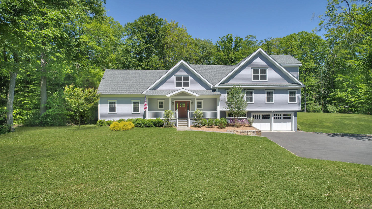 729 Cheese Spring Road New Canaan, CT 06840 - Photo 1 of 37 a front view of a house with yard and green space