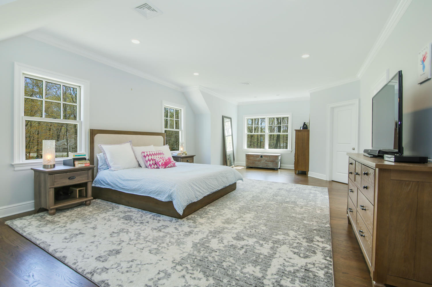 729 Cheese Spring Road New Canaan, CT 06840 - Photo 15 of 37 a spacious bedroom with a large bed and a flat screen tv