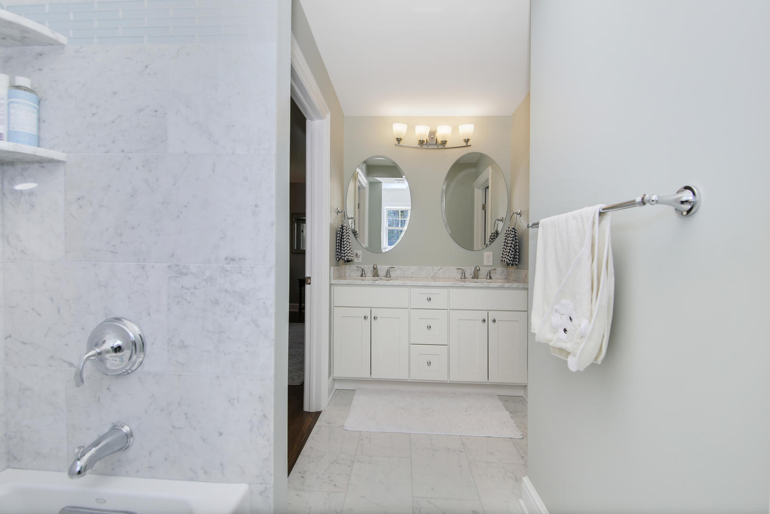 729 Cheese Spring Road New Canaan, CT 06840 - Photo 19 of 37 a bathroom with a double vanity sink and mirror