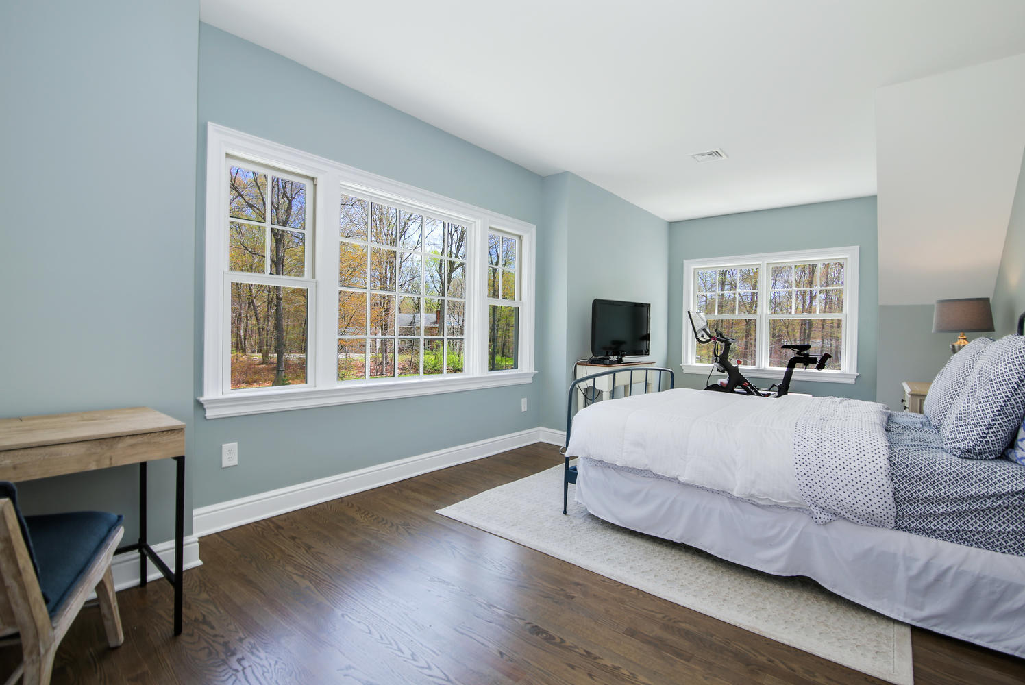 729 Cheese Spring Road New Canaan, CT 06840 - Photo 25 of 37 a bedroom with a large bed and a large window