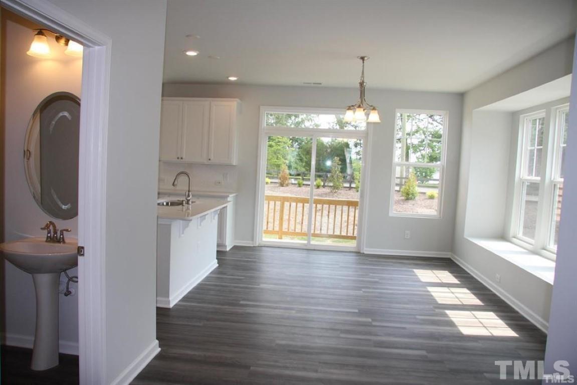 2919 Sunflower Road Apex, NC 27502 - Photo 12 of 34 a view of a room with wooden floor and windows