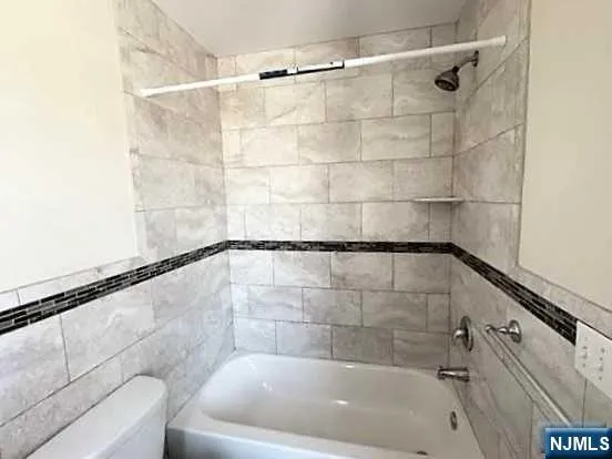 a bathroom with a shower and a bathtub