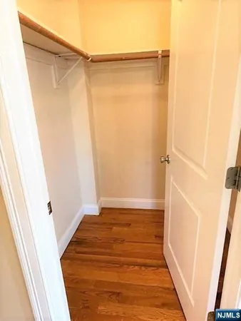 a bathroom with a shower and a glass door