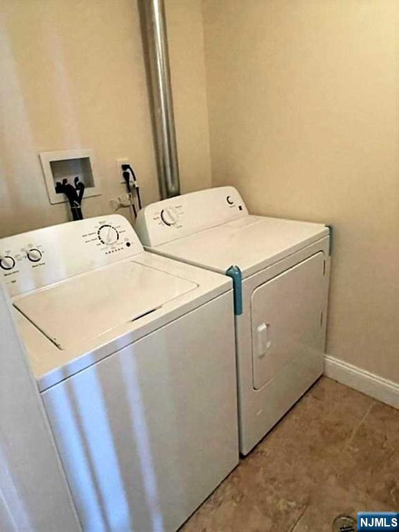 315 Frank E Rodgers Boulevard North, Unit 3 Harrison, NJ 07029 - Photo 6 of 18 a utility room with dryer and washer