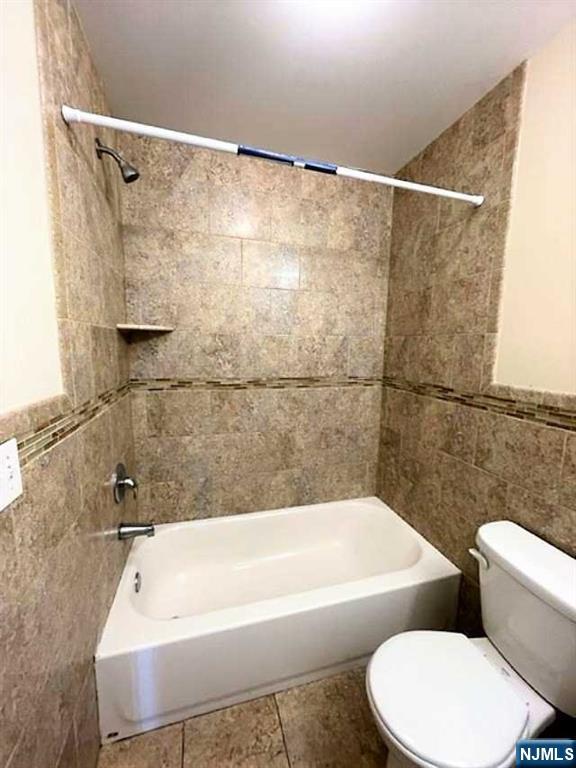 315 Frank E Rodgers Boulevard North, Unit 3 Harrison, NJ 07029 - Photo 8 of 18 a bathroom with a white bath tub and a shower