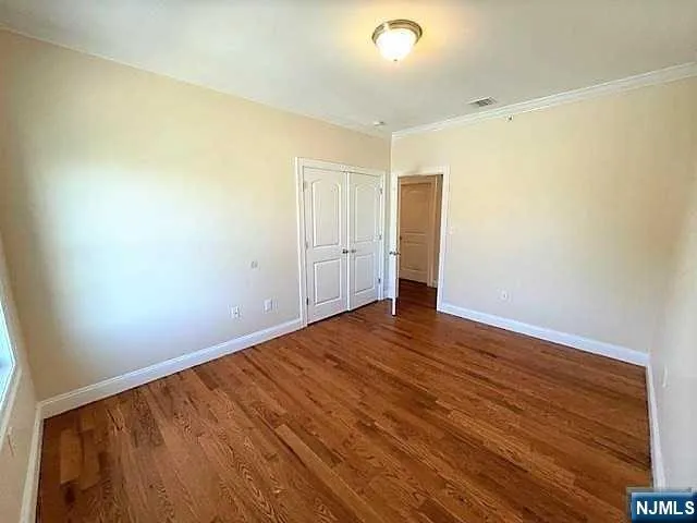 an empty room with wooden floor