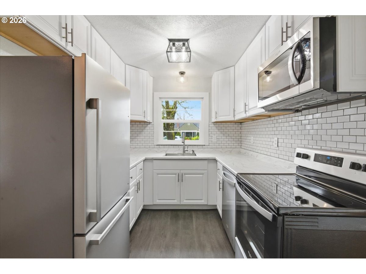 1084 24th Street Northeast Salem, OR 97301 - Photo 12 of 30 a kitchen that has a cabinets and a stove