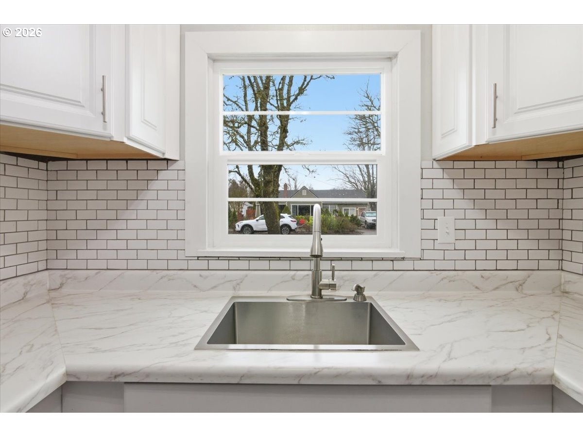 1084 24th Street Northeast Salem, OR 97301 - Photo 13 of 30 a view of a sink a window and a kitchen counter