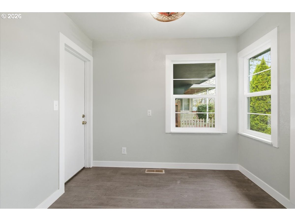 1084 24th Street Northeast Salem, OR 97301 - Photo 15 of 30 an empty room with wooden floor and windows