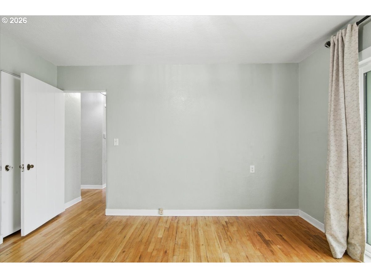 1084 24th Street Northeast Salem, OR 97301 - Photo 20 of 30 a view of an empty room and wooden floor