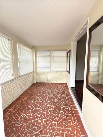 a view of an empty room and window