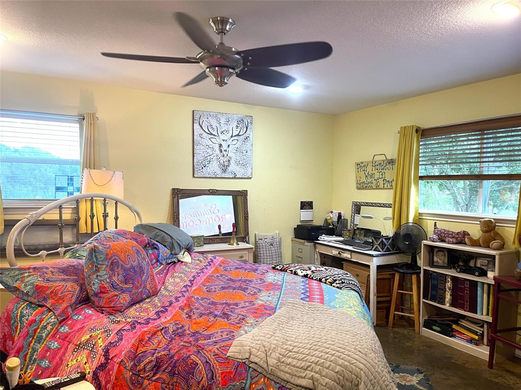 151 Lcr Cedar C3 Mexia, TX 76667 - Photo 12 of 28 a bedroom with a bed and a window