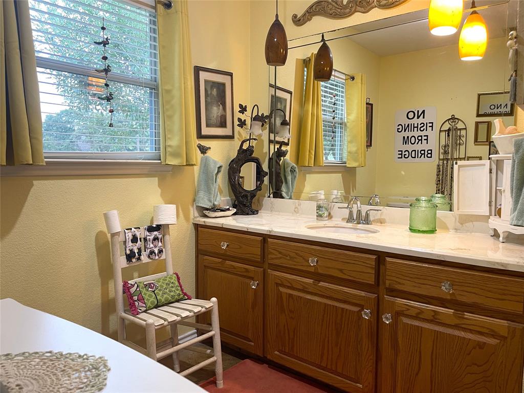 151 Lcr Cedar C3 Mexia, TX 76667 - Photo 15 of 28 a bathroom with a sink and a mirror
