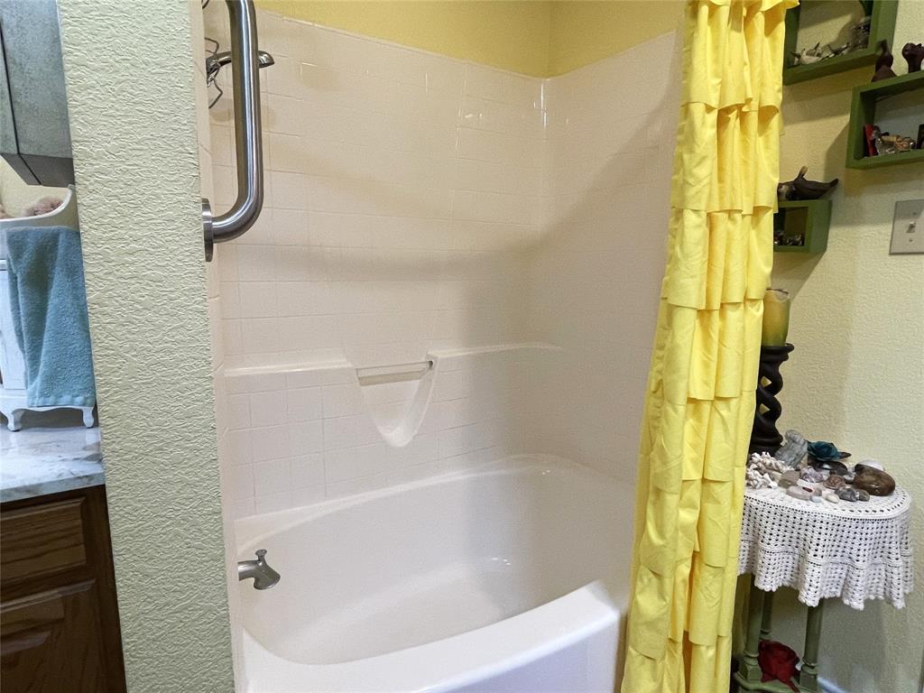 151 Lcr Cedar C3 Mexia, TX 76667 - Photo 16 of 28 a bathroom with a bath tub