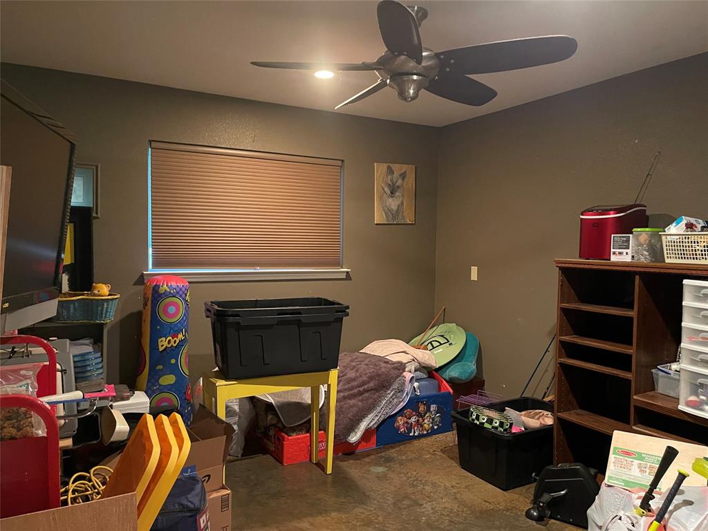 151 Lcr Cedar C3 Mexia, TX 76667 - Photo 17 of 28 a living room with furniture a flat screen tv and a fireplace