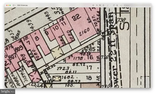 a sign broad on a brick wall