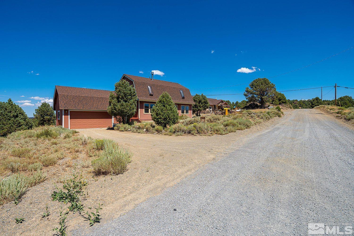 21400 Graves Road Reno, NV 89521 - Photo 21 of 21 a view of a dry yard with large trees