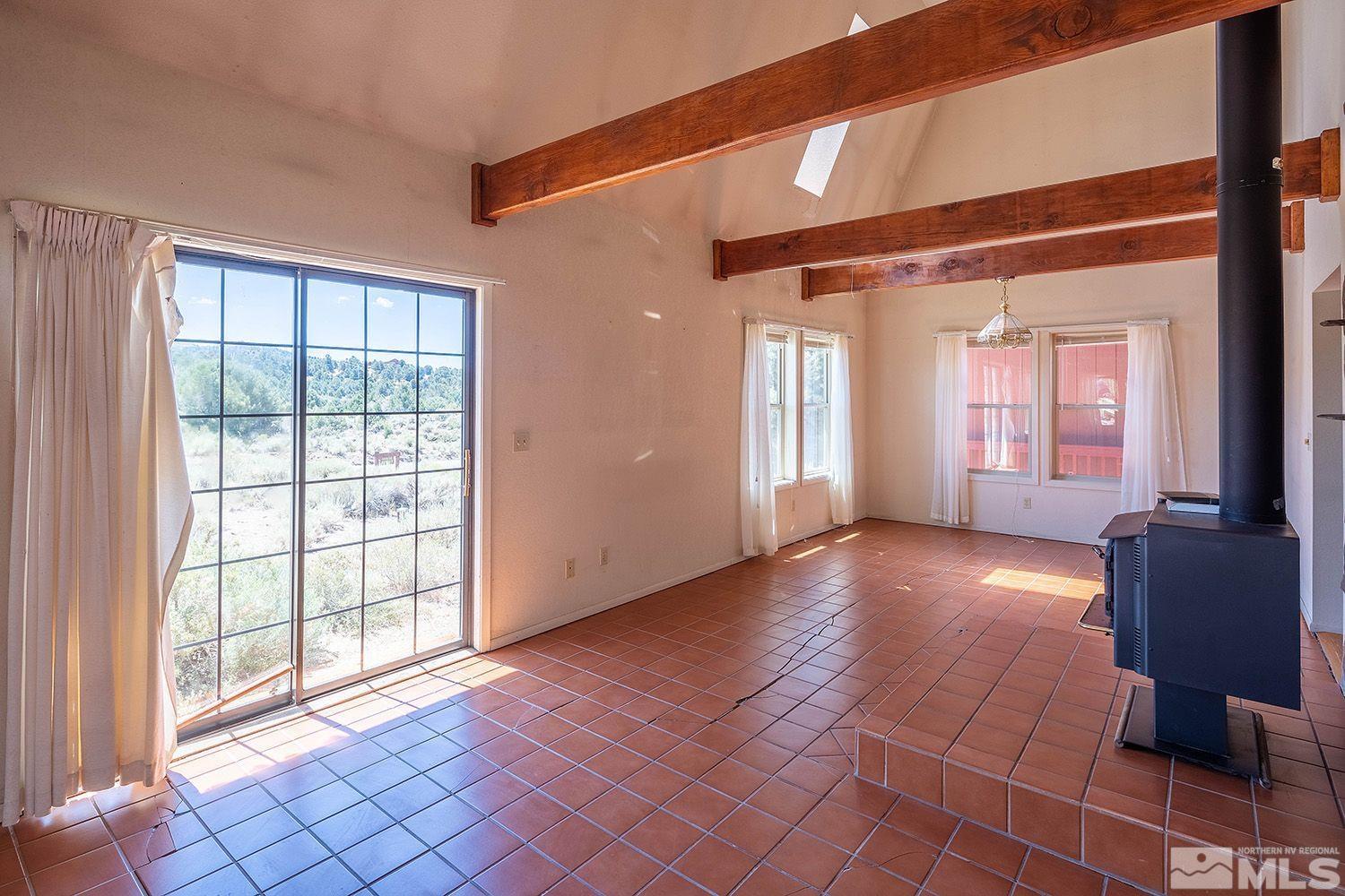 21400 Graves Road Reno, NV 89521 - Photo 6 of 21 a view of livingroom with furniture and windows
