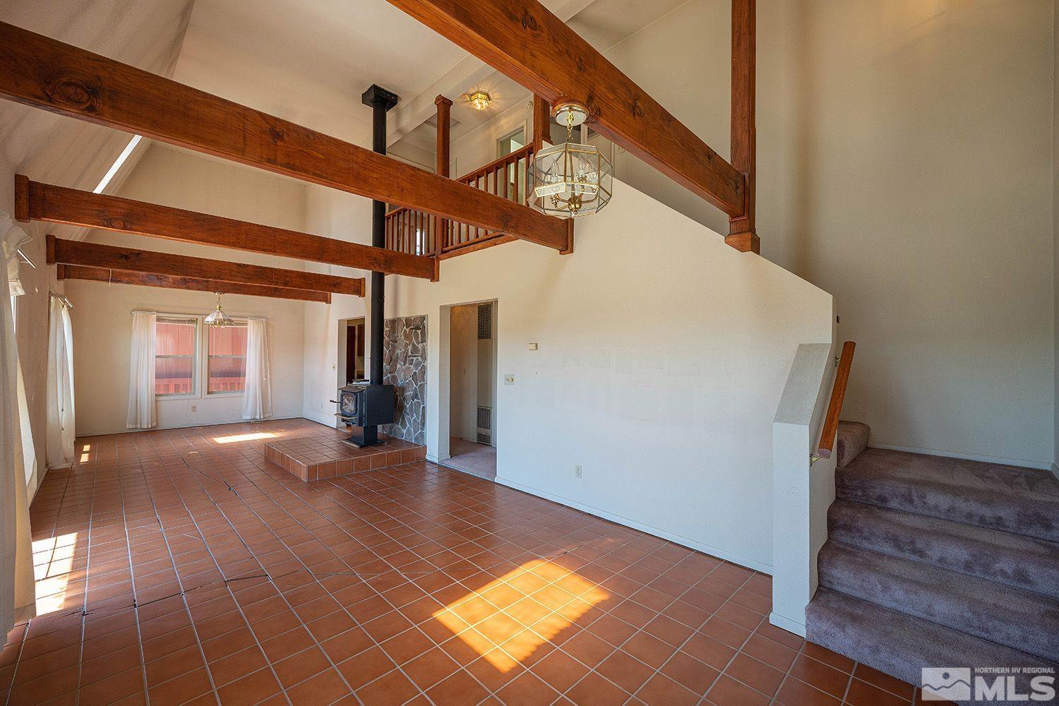 21400 Graves Road Reno, NV 89521 - Photo 7 of 21 a view of a hallway with entryway and hall with wooden floor