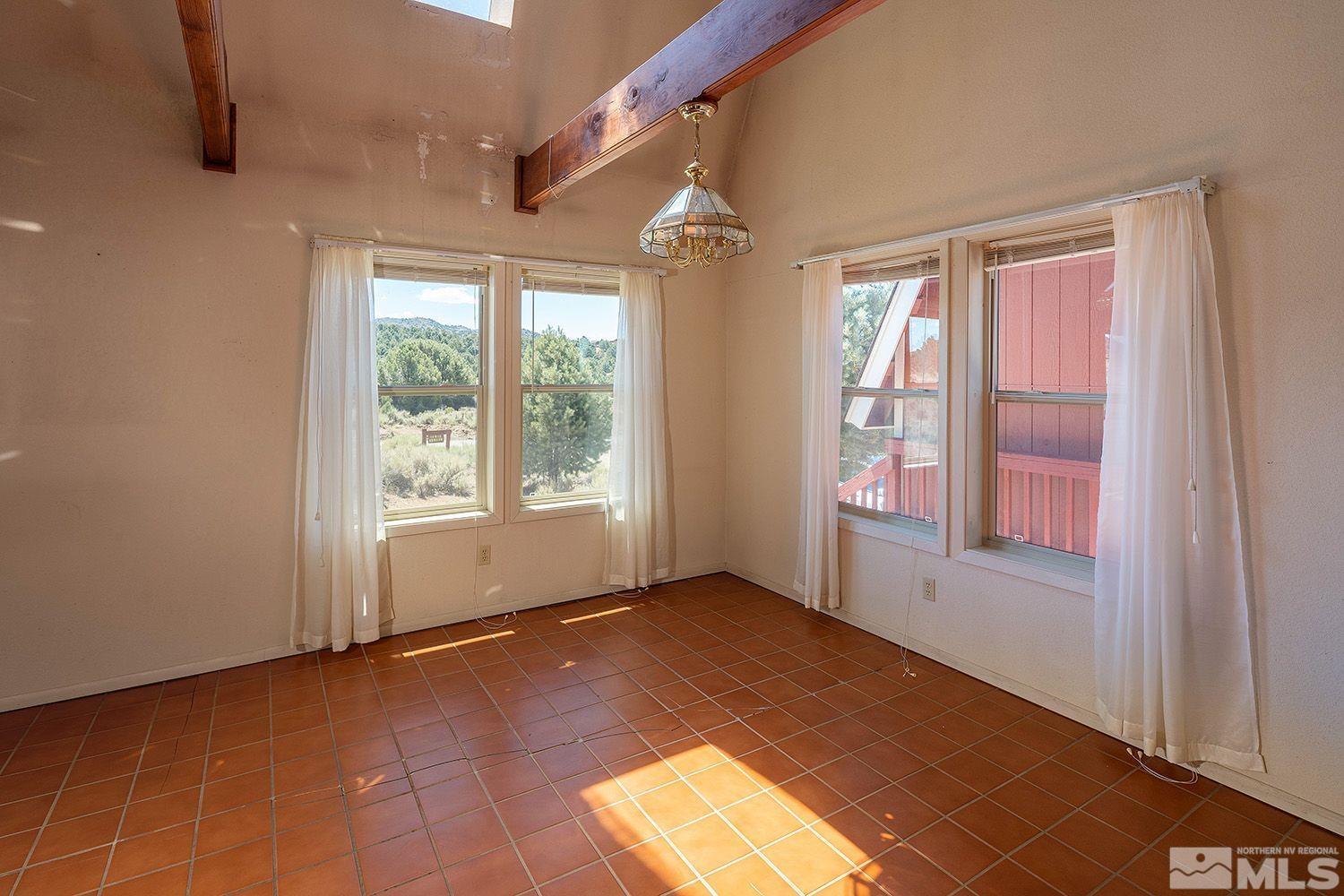 21400 Graves Road Reno, NV 89521 - Photo 8 of 21 a view of empty room with window