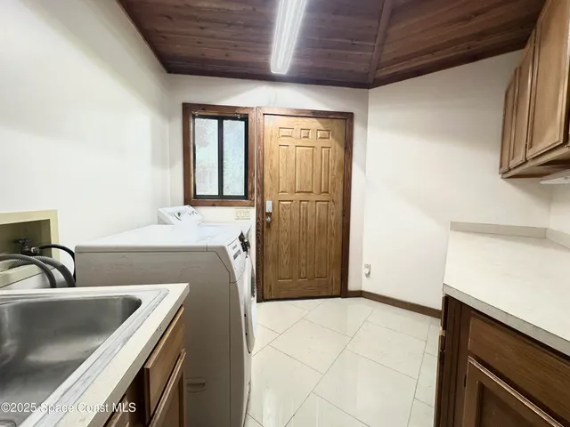 a bathroom with a granite countertop sink and a bathtub