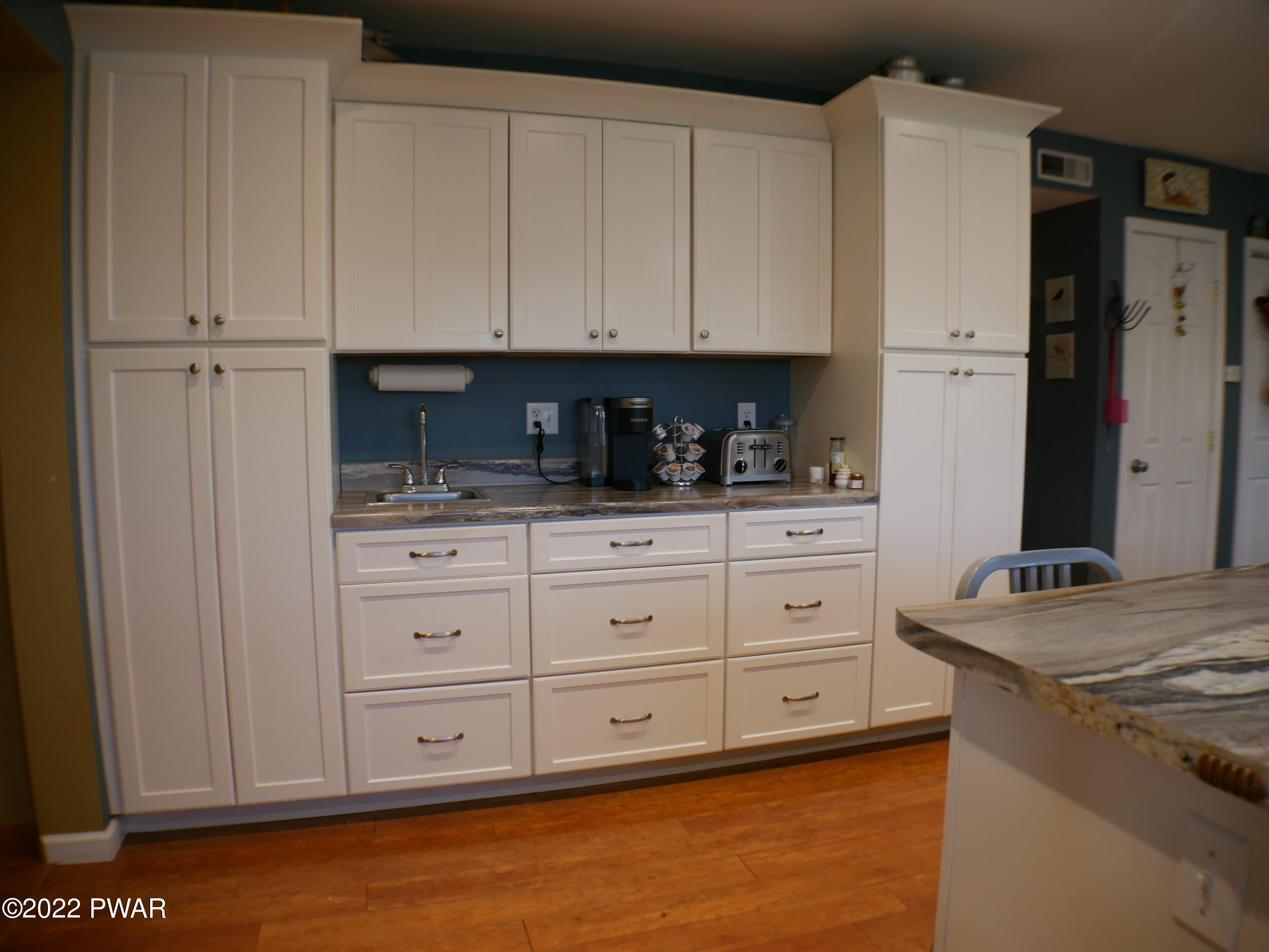 1259 Dougherty Road Meshoppen, PA 18630 - Photo 15 of 61 a kitchen with stainless steel appliances granite countertop a stove a refrigerator and a white cabinets
