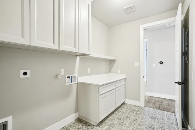 a room with wooden floor and entrance