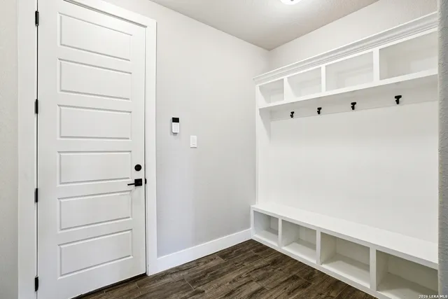 a view of a room with furniture and windows