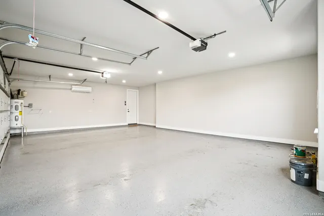 a view of empty room with a fireplace and wooden floor