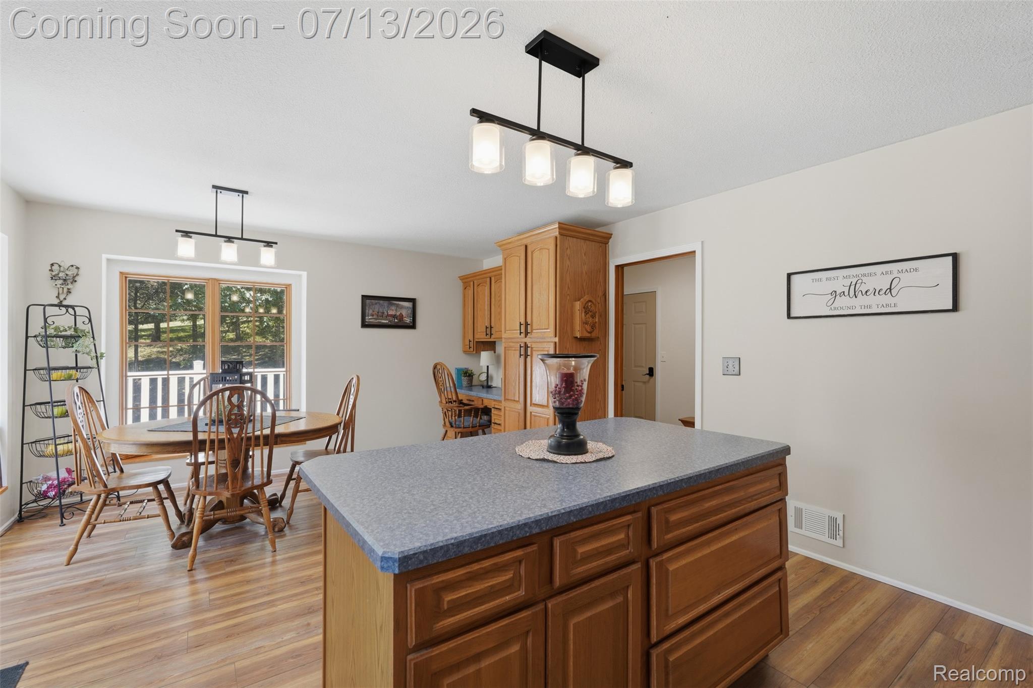 10525 Antcliff Road Brooklyn, MI 49230 - Photo 15 of 80 Kitchen featuring new laminate flooring and panoramic views from the wraparound porch