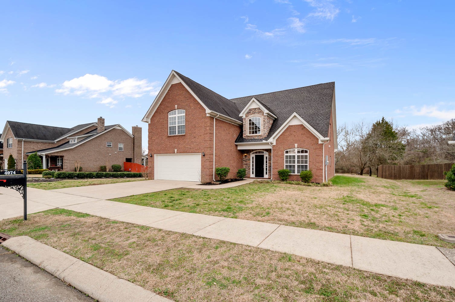 4074 Locerbie Circle Spring Hill, TN 37174 - Photo 1 of 23 a front view of a house with a yard