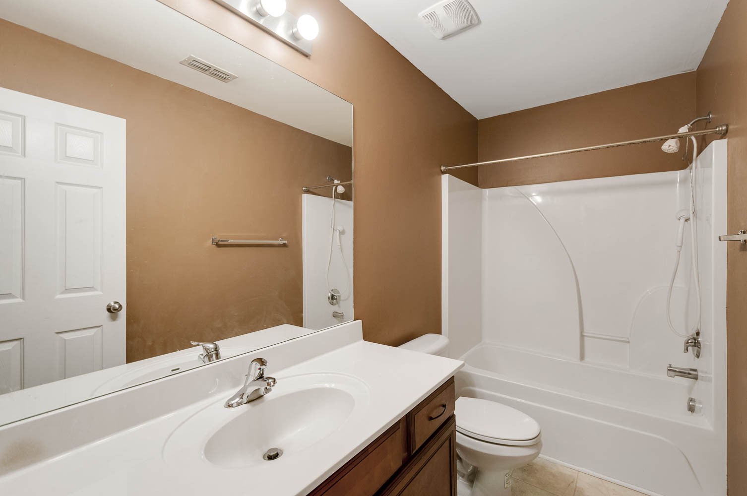 4074 Locerbie Circle Spring Hill, TN 37174 - Photo 17 of 23 a bathroom with a sink toilet and shower