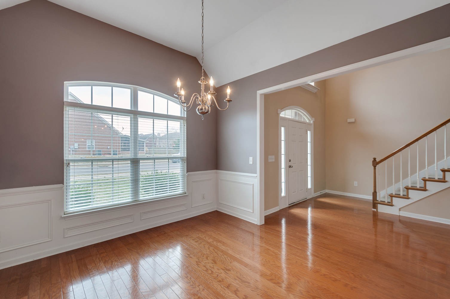 4074 Locerbie Circle Spring Hill, TN 37174 - Photo 4 of 23 a view of an empty room with wooden floor and a window