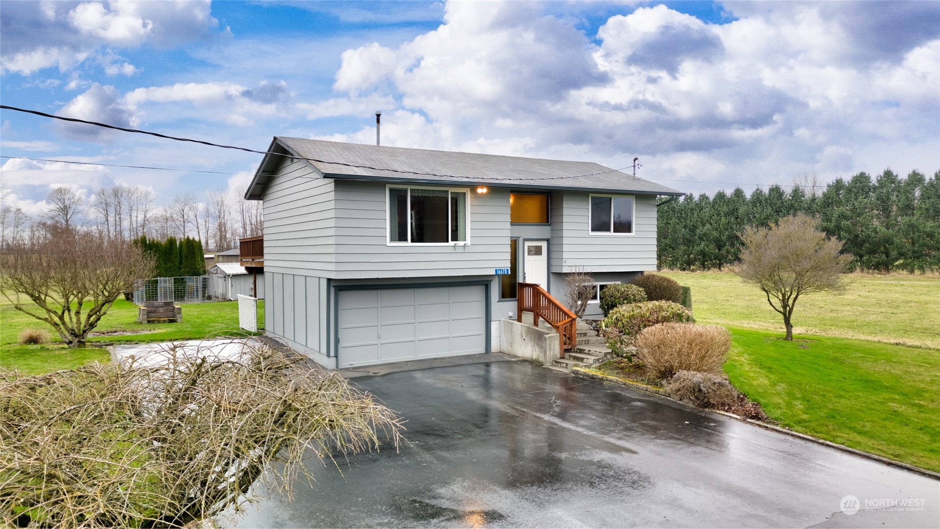 a front view of a house with garden