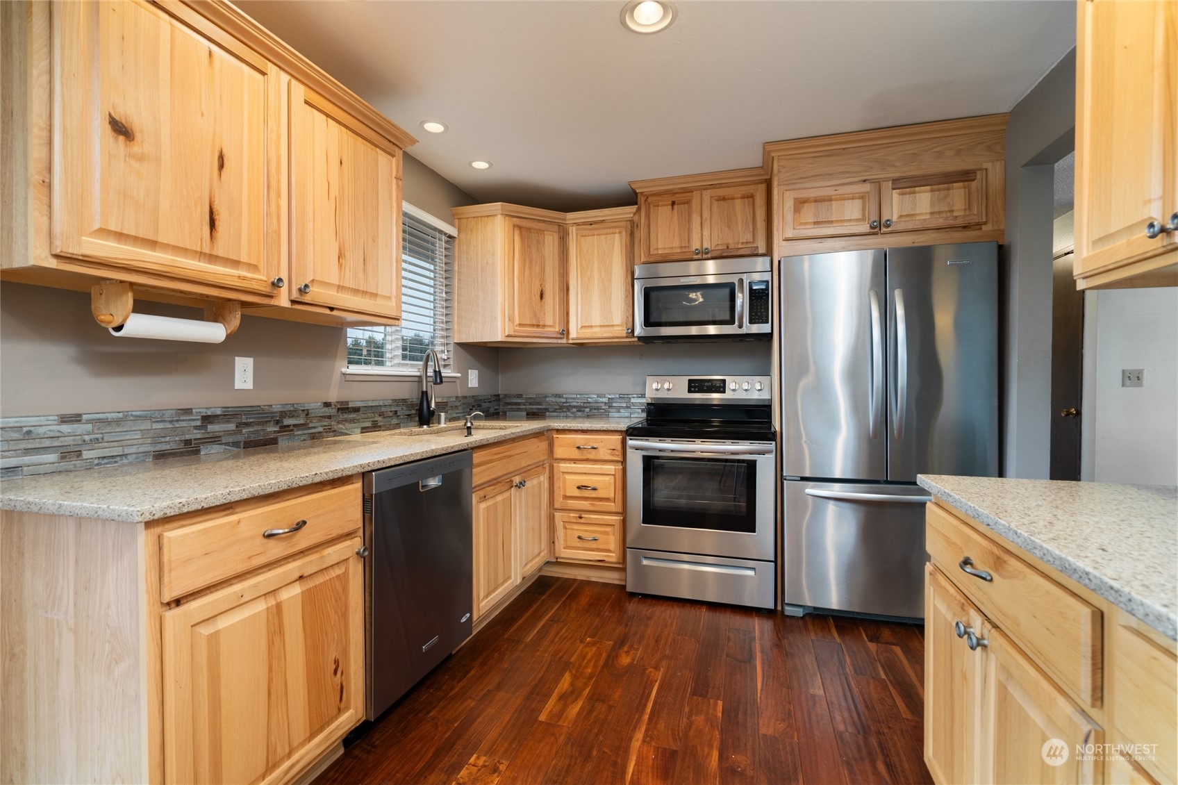 16678 Dike Road Mount Vernon, WA 98273 - Photo 11 of 37 a kitchen with granite countertop stainless steel appliances and wooden cabinets