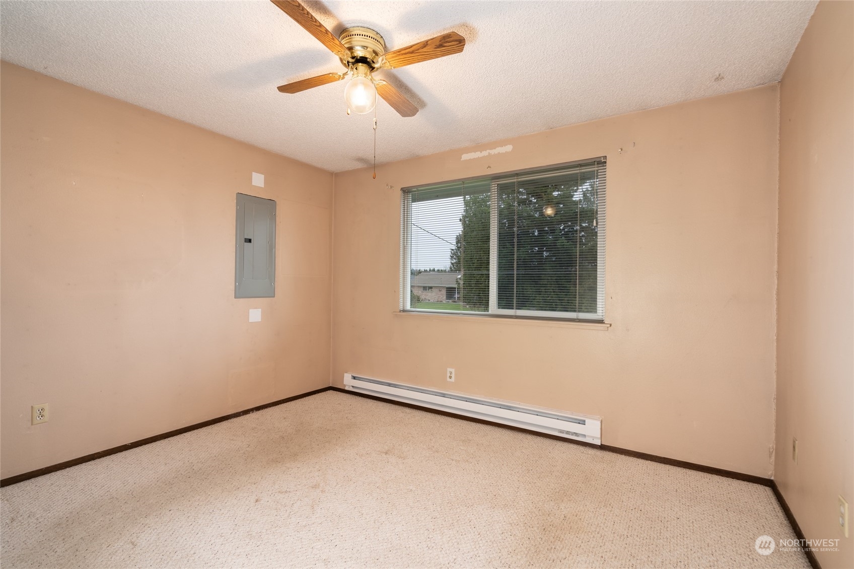 16678 Dike Road Mount Vernon, WA 98273 - Photo 15 of 37 an empty room with a window and a ceiling fan