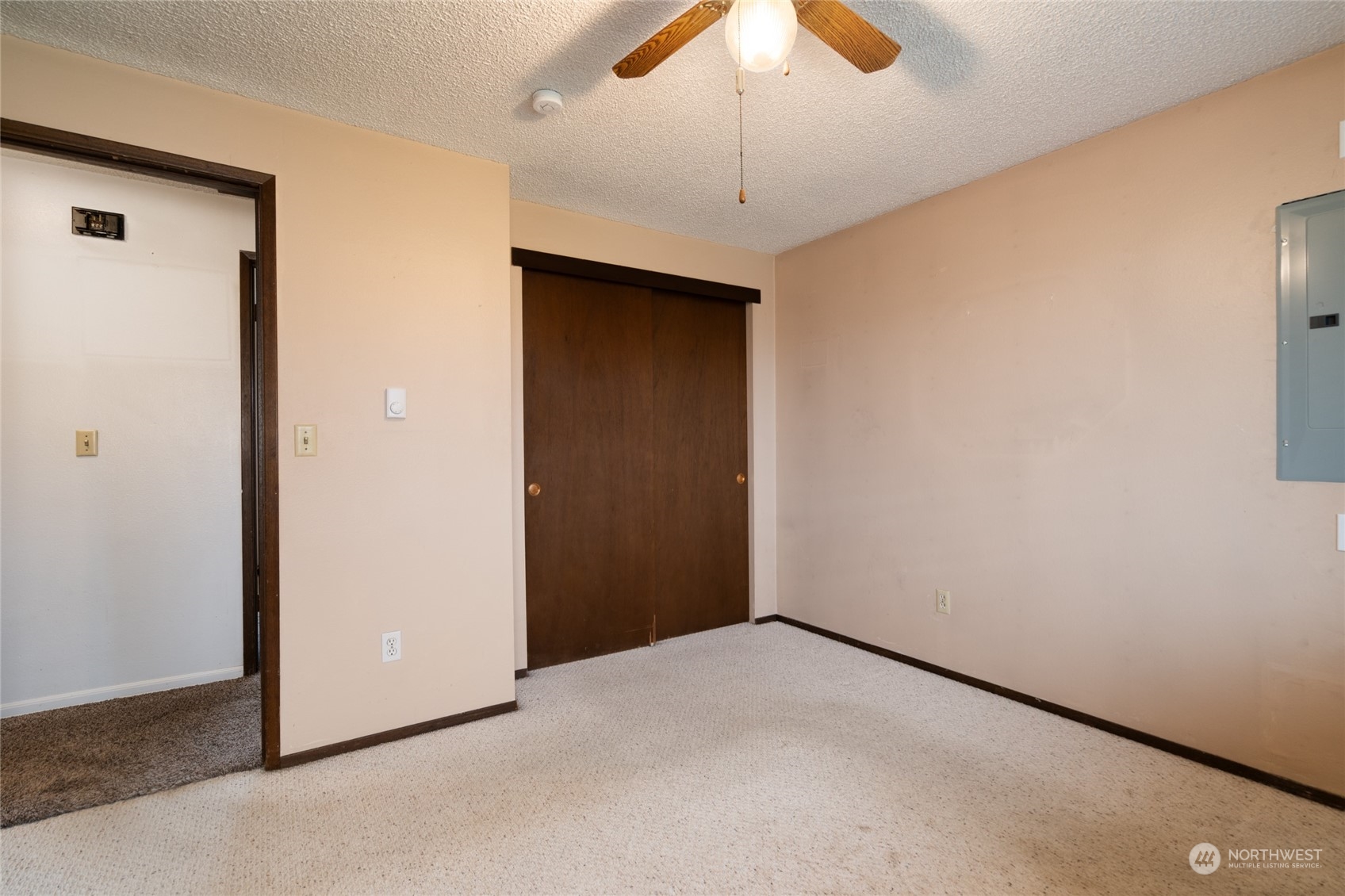 16678 Dike Road Mount Vernon, WA 98273 - Photo 16 of 37 an empty room with a chandelier fan