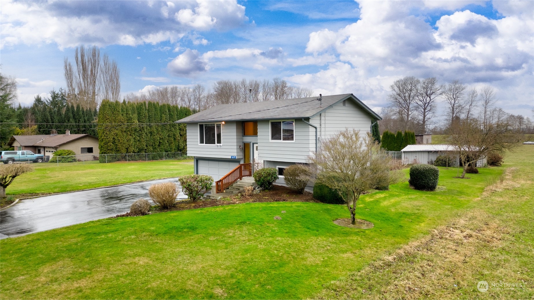 16678 Dike Road Mount Vernon, WA 98273 - Photo 3 of 37 a view of a house with backyard sitting area and garden