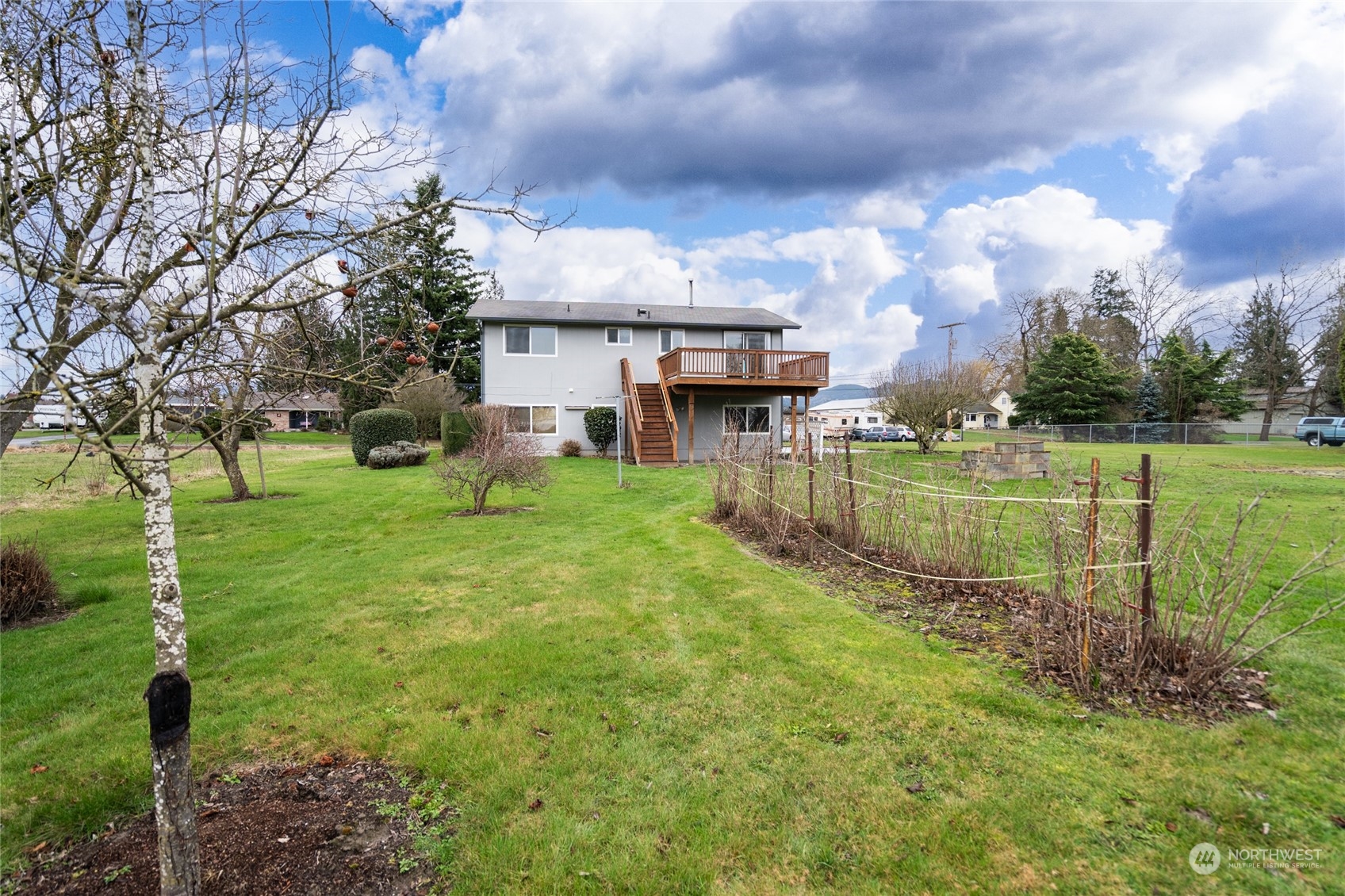 16678 Dike Road Mount Vernon, WA 98273 - Photo 36 of 37 a view of a house with a big yard and a fountain
