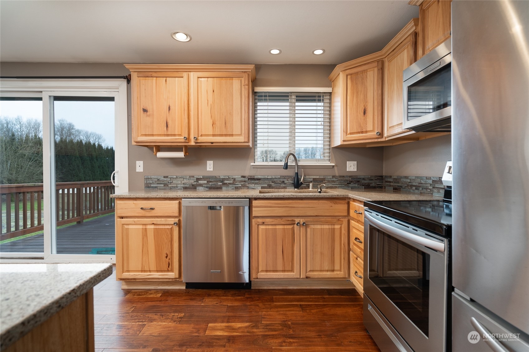 16678 Dike Road Mount Vernon, WA 98273 - Photo 10 of 37 a kitchen with granite countertop cabinets stainless steel appliances a sink and a large window