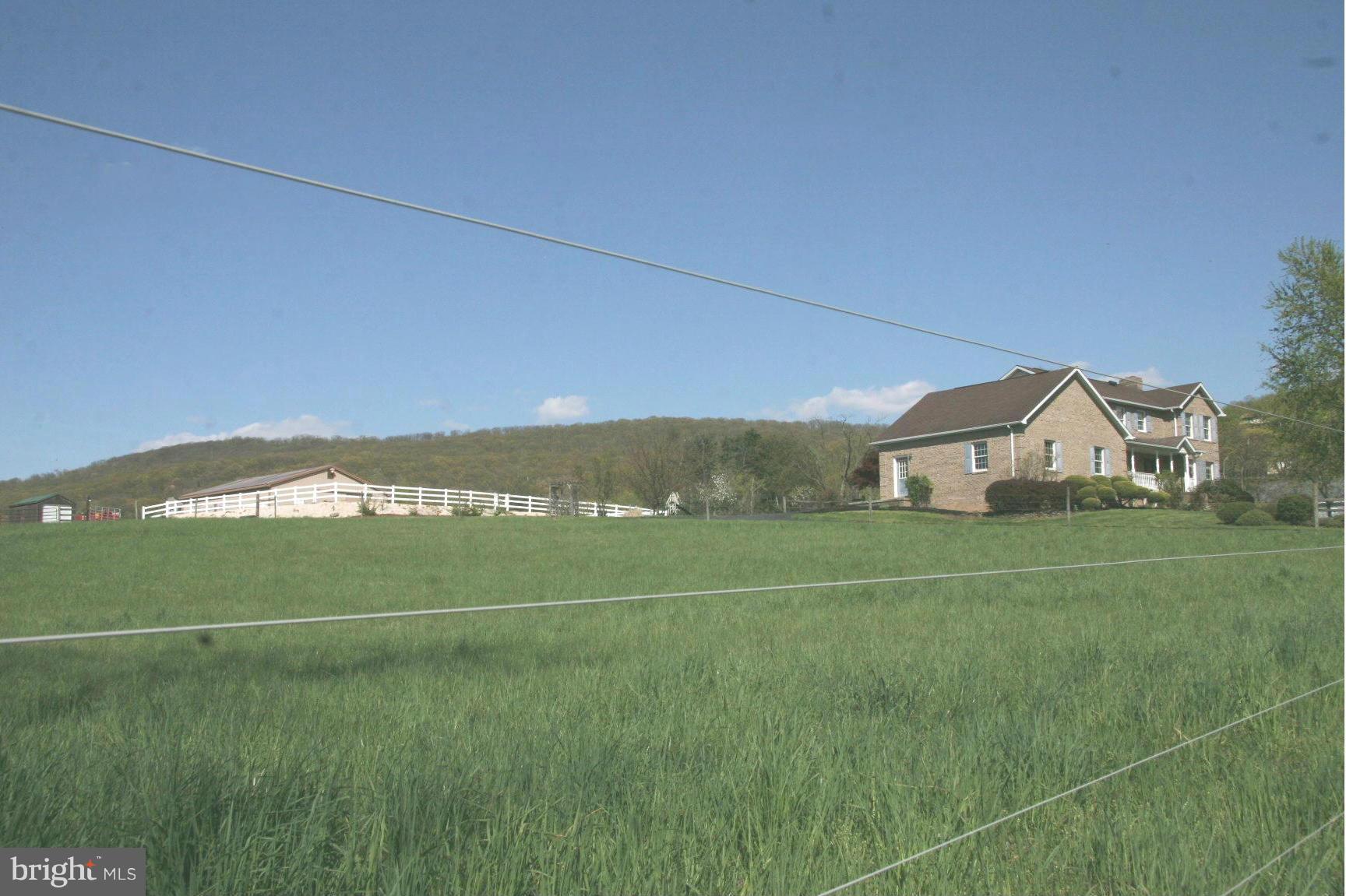 20834 Netz Road Boonsboro, MD 21713 - Photo 1 of 30 a view of a field with an house in background
