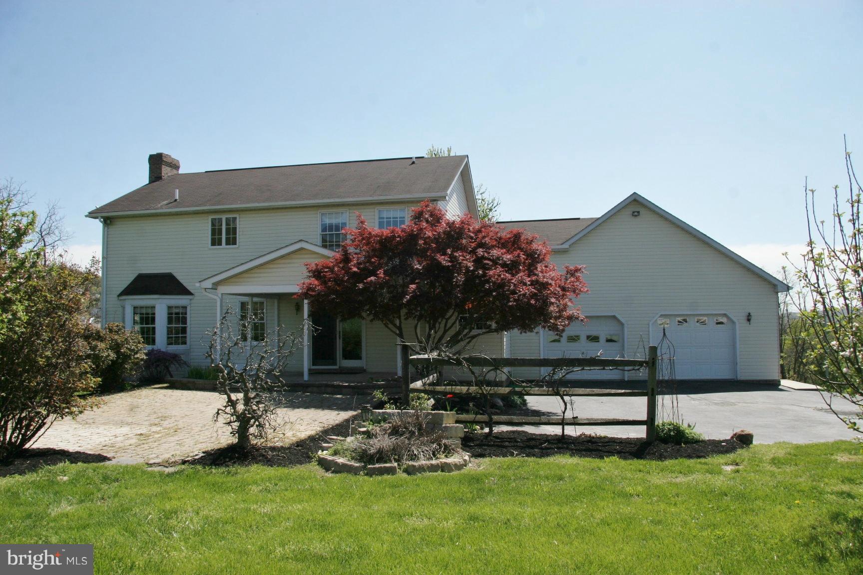 20834 Netz Road Boonsboro, MD 21713 - Photo 27 of 30 a front view of a house with a garden and plants