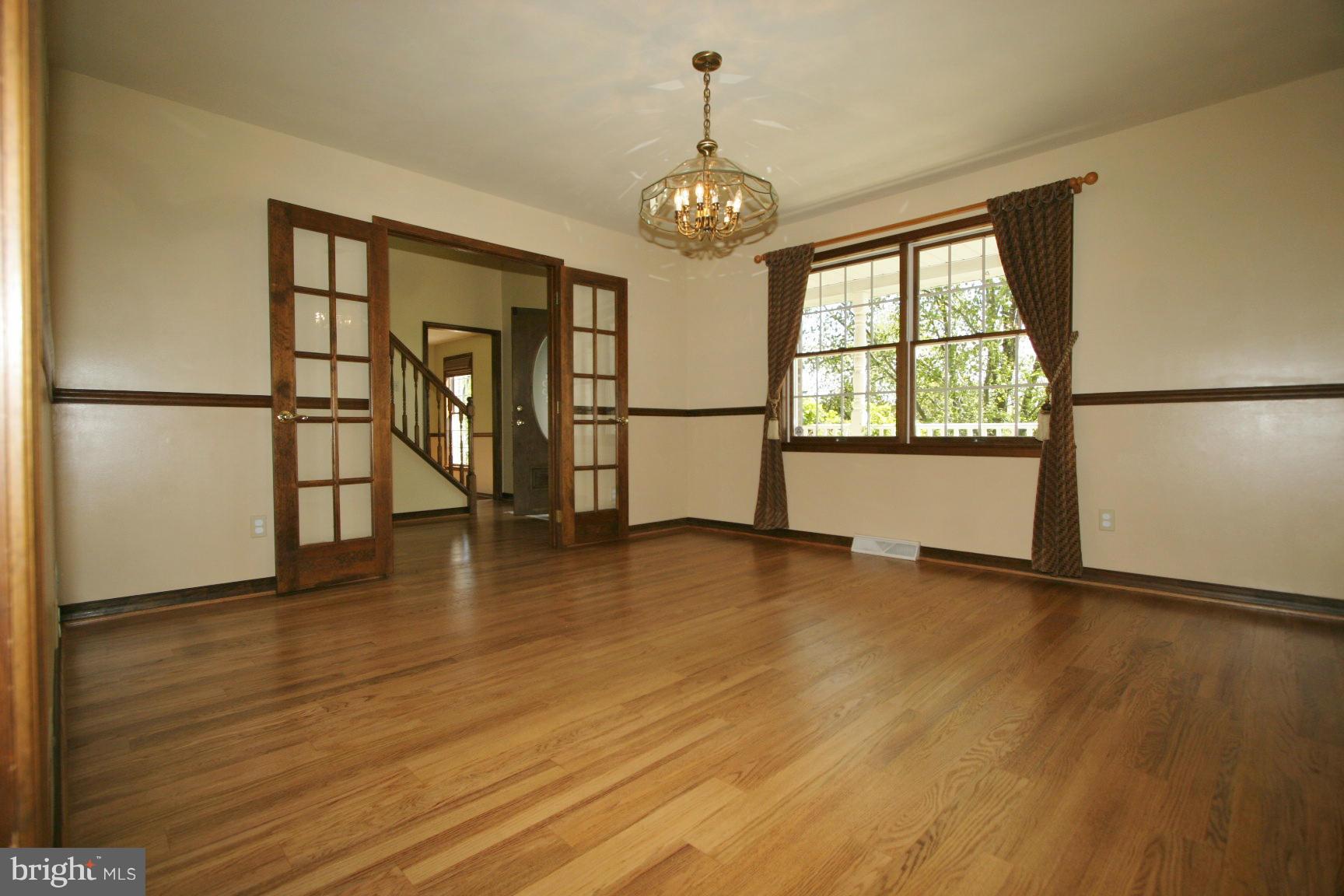 20834 Netz Road Boonsboro, MD 21713 - Photo 6 of 30 a view of an empty room with wooden floor and a window