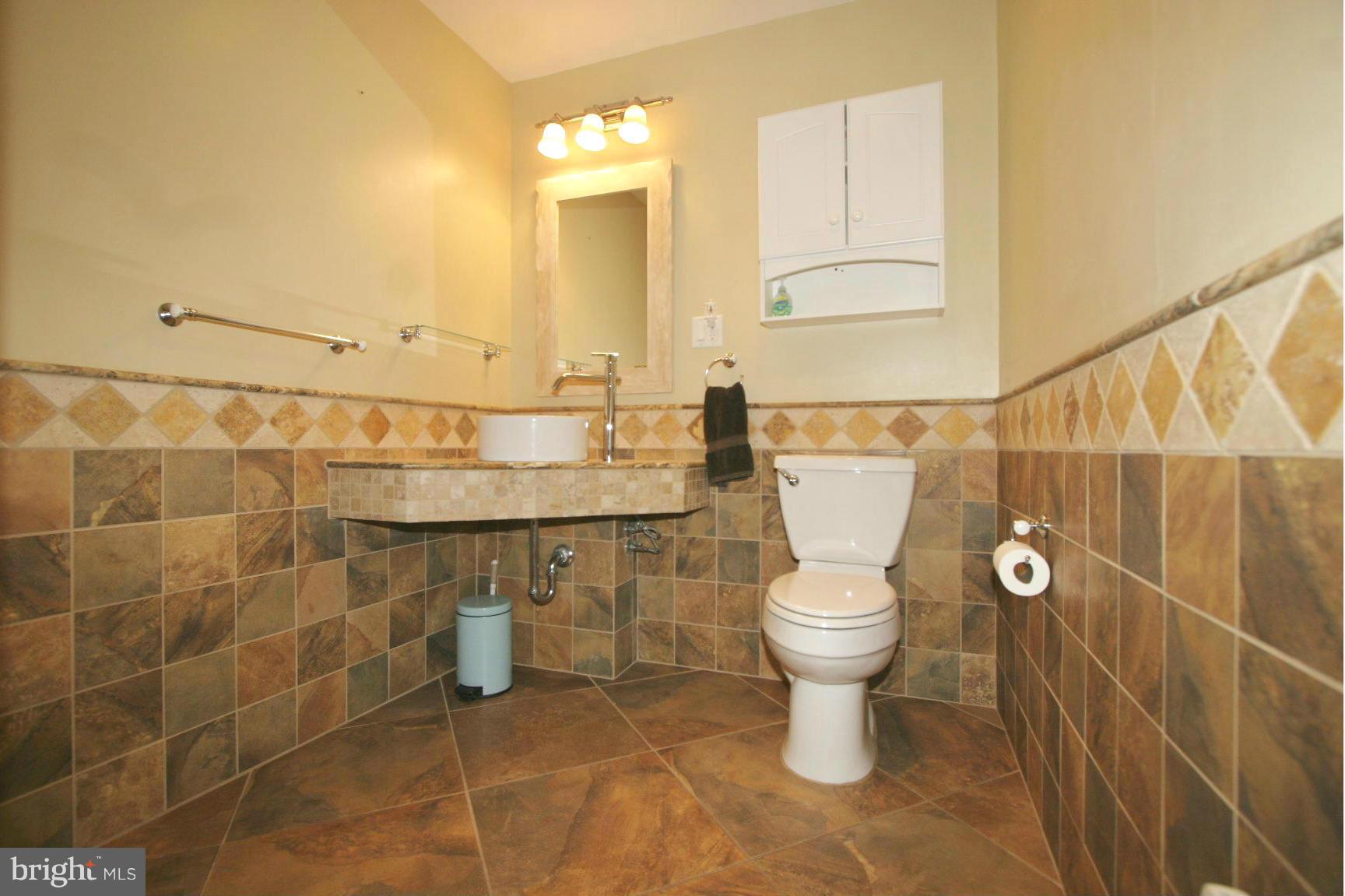 20834 Netz Road Boonsboro, MD 21713 - Photo 7 of 30 a bathroom with a toilet a sink and a shower
