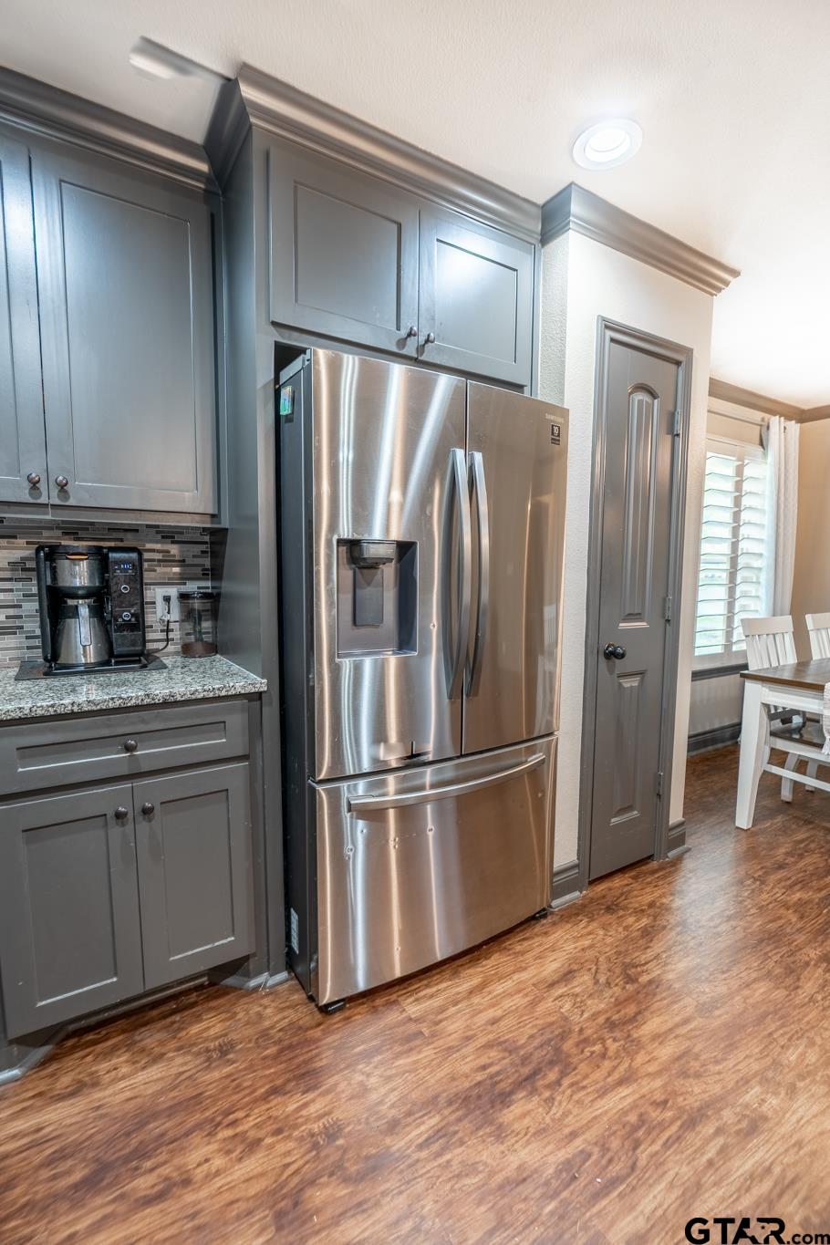 14062 Bent Trail Tyler, TX 75707 - Photo 11 of 46 a kitchen with stainless steel appliances granite countertop a refrigerator and a sink