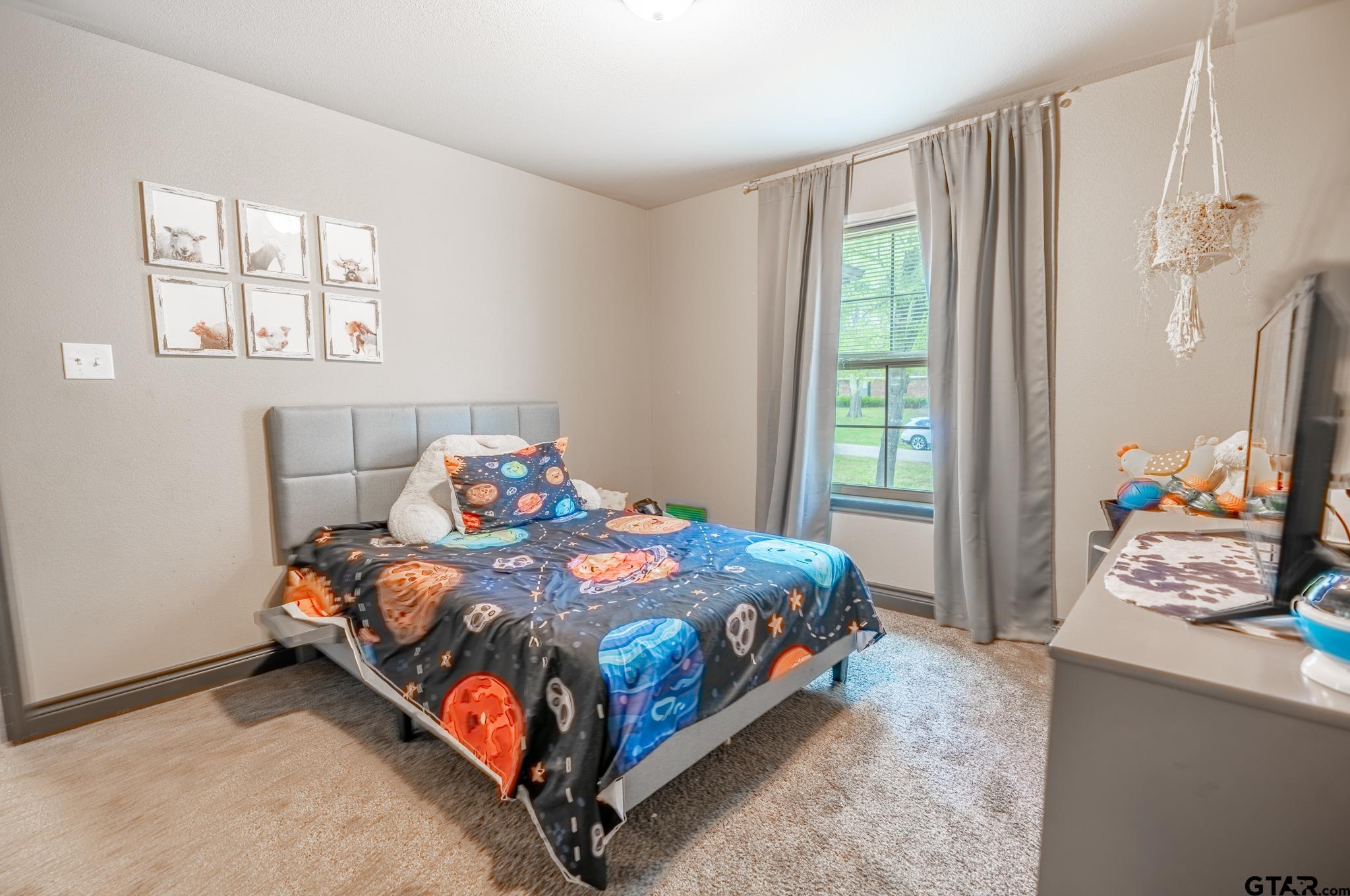 14062 Bent Trail Tyler, TX 75707 - Photo 13 of 46 a bedroom with a bed and window
