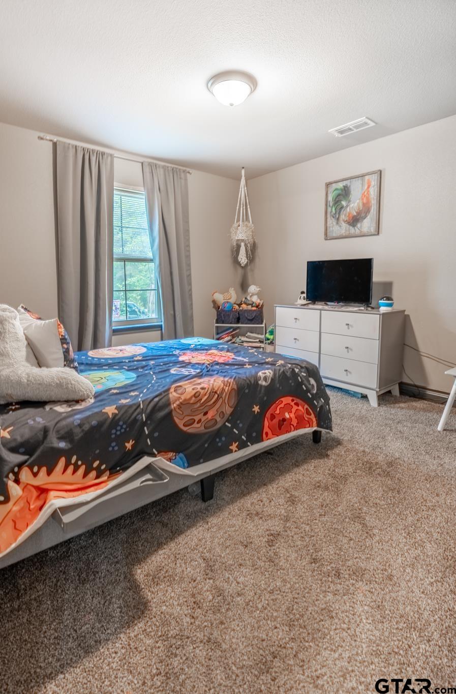 14062 Bent Trail Tyler, TX 75707 - Photo 14 of 46 a bedroom with bed and window