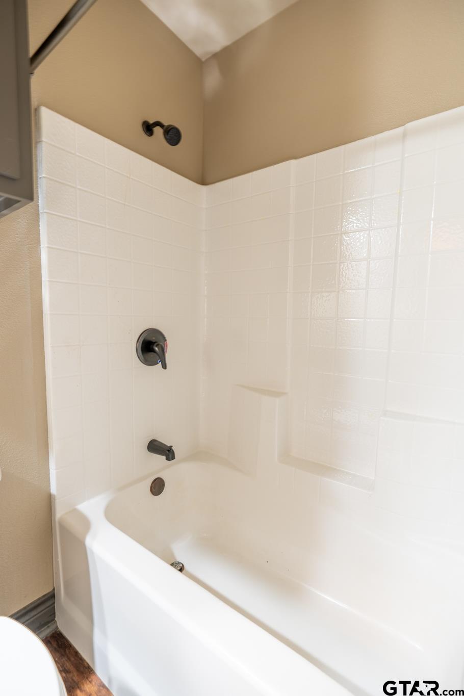 14062 Bent Trail Tyler, TX 75707 - Photo 16 of 46 a bathroom with a bathtub